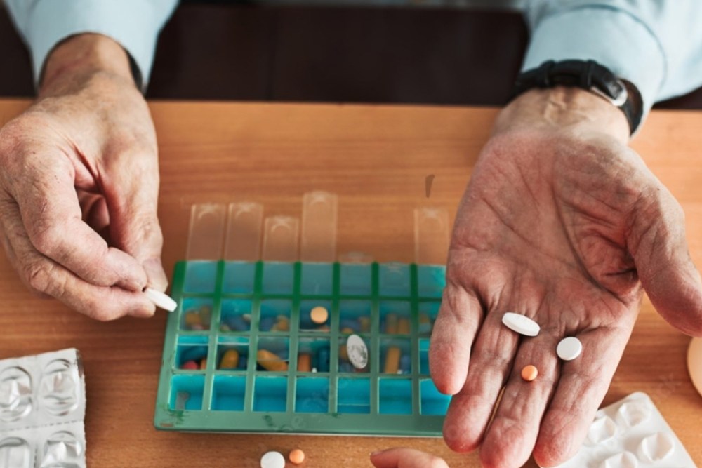 Senior man organizing his medication