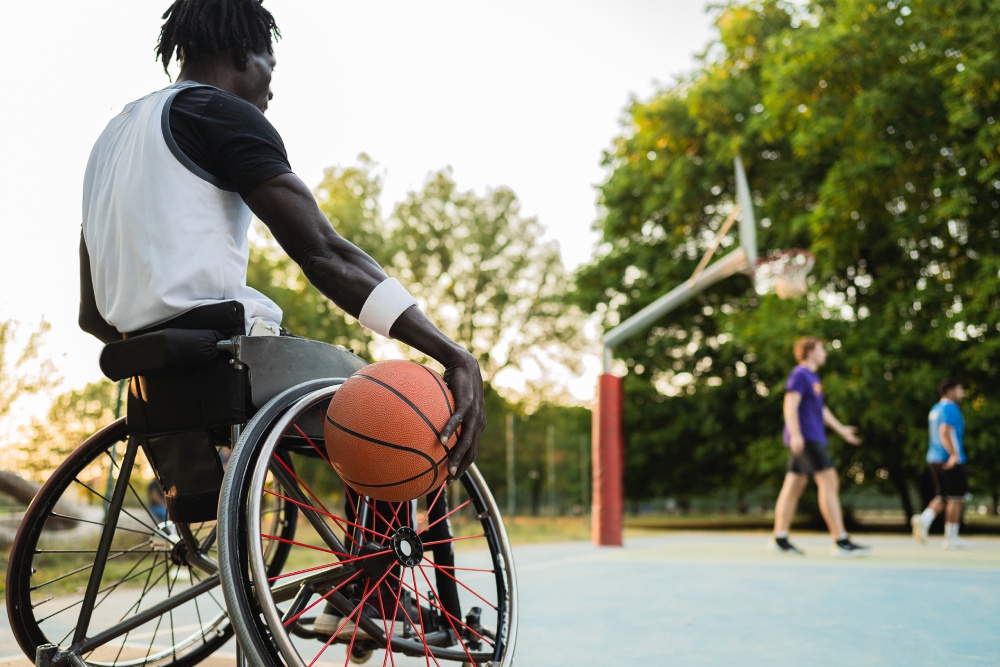 Paraplegic basketball player in wheelchair waiting for playing
